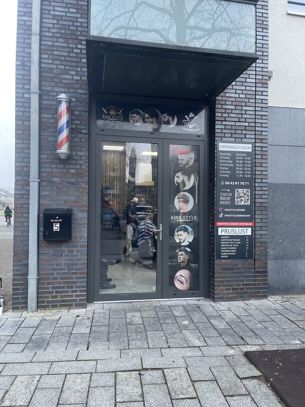De gevel van King Style Barbershop aan de Wolfsberg in Deurne